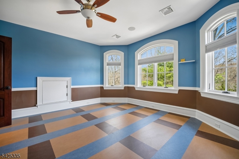 318 Franklin Road Denville, NJ 07834 - Photo 19 of 40 a bedroom with a bed and a large window