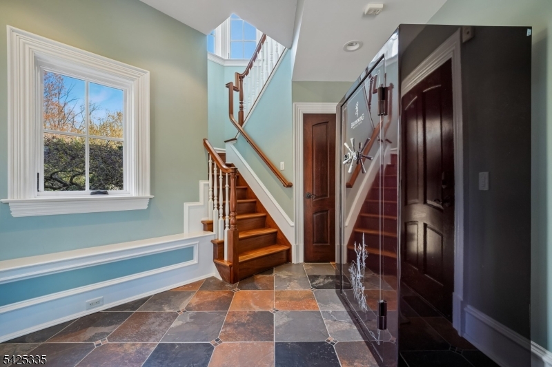 318 Franklin Road Denville, NJ 07834 - Photo 24 of 40 a view of an entryway with wooden floor and stairs