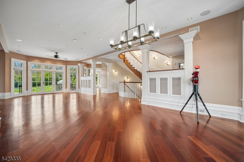 318 Franklin Road Denville, NJ 07834 - Photo 3 of 40 a view of empty room with wooden floor and fan