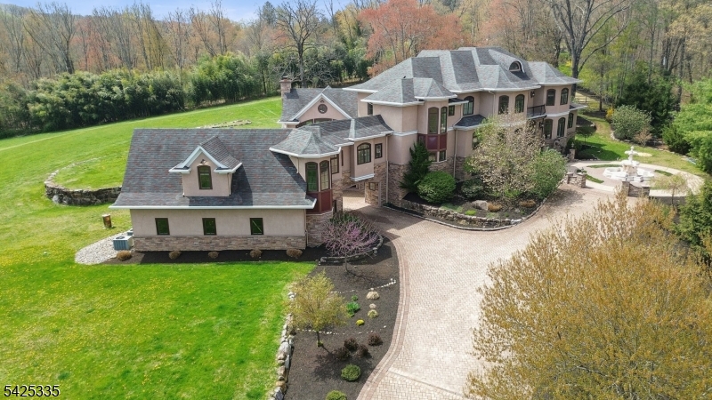 318 Franklin Road Denville, NJ 07834 - Photo 35 of 40 a front view of a house with a garden