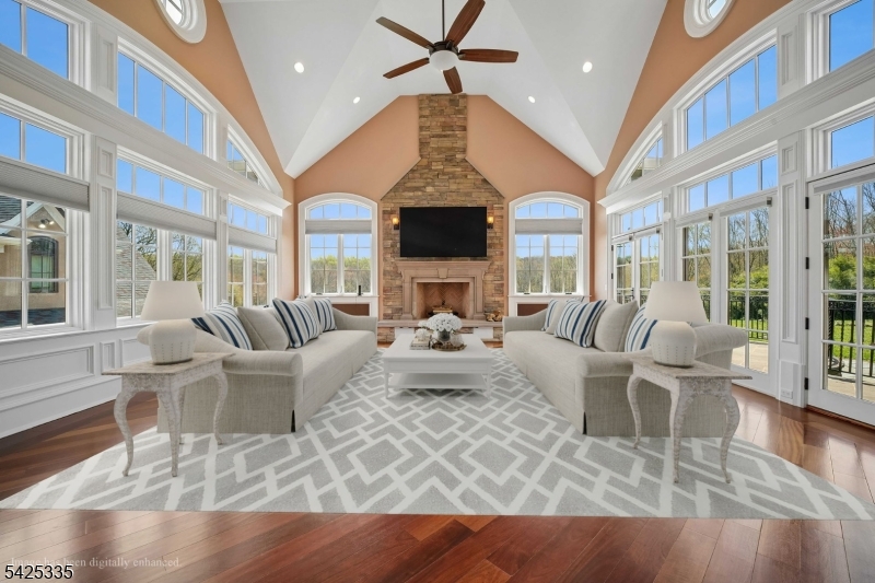 318 Franklin Road Denville, NJ 07834 - Photo 7 of 40 a living room with fireplace furniture and a wooden floor