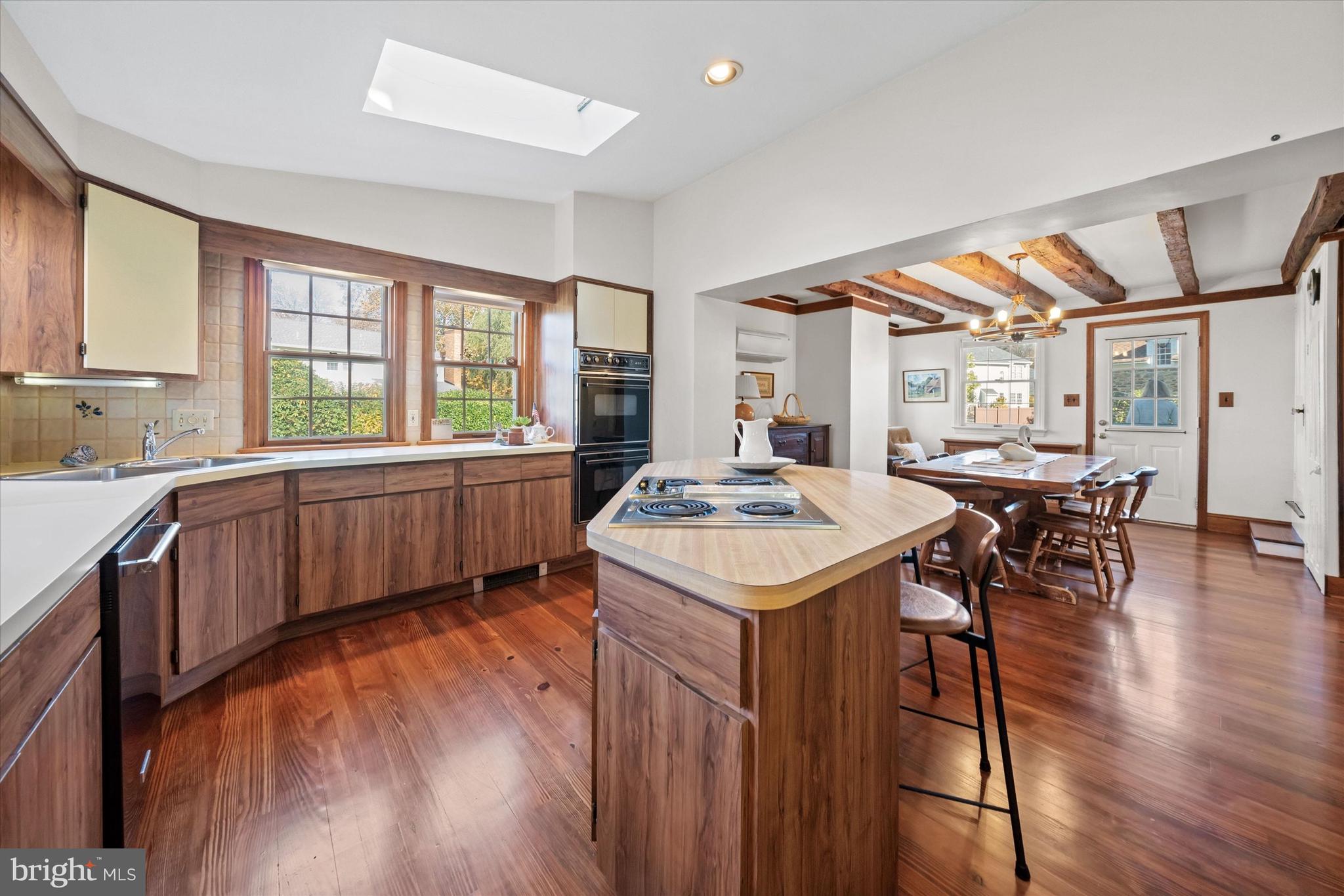 1509 Turkey Run Road Wilmington, DE 19803 - Photo 11 of 31 a large kitchen with kitchen island a large window a sink and counter space