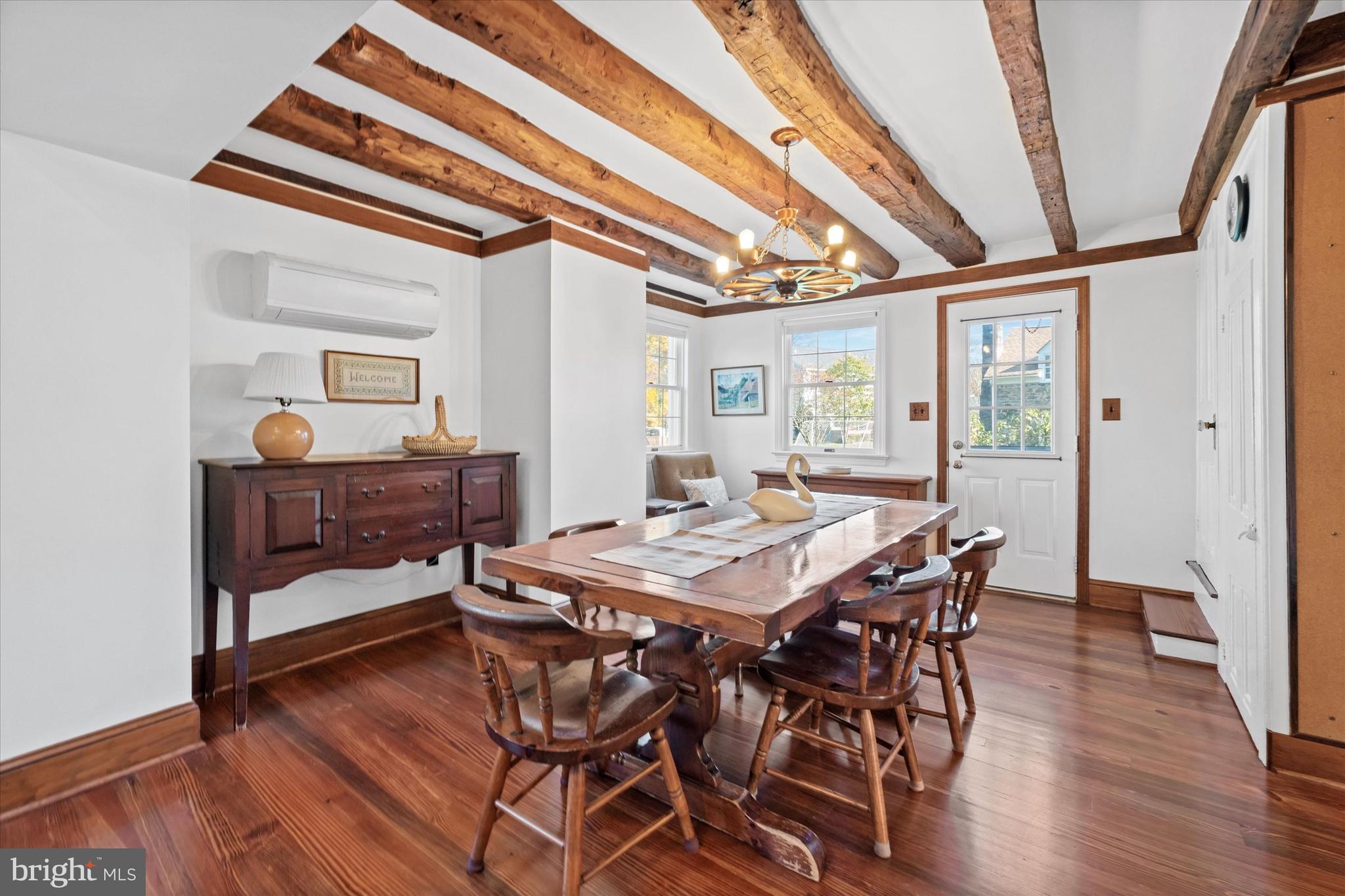 1509 Turkey Run Road Wilmington, DE 19803 - Photo 12 of 31 a view of a dining room with furniture and wooden floor