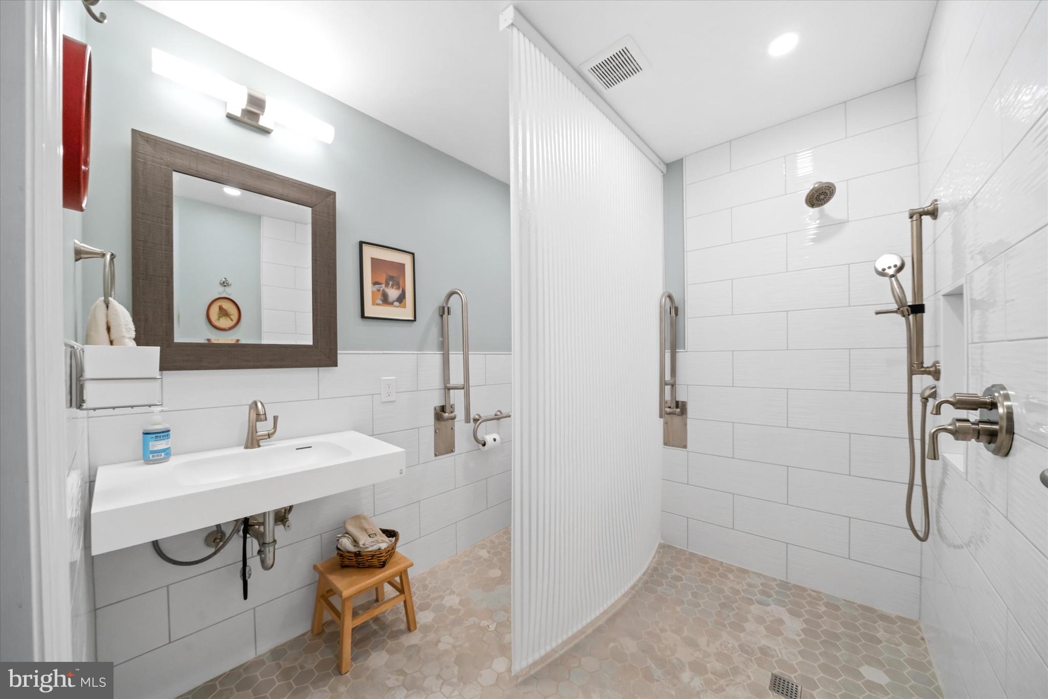 1509 Turkey Run Road Wilmington, DE 19803 - Photo 14 of 31 a bathroom with a sink and a mirror