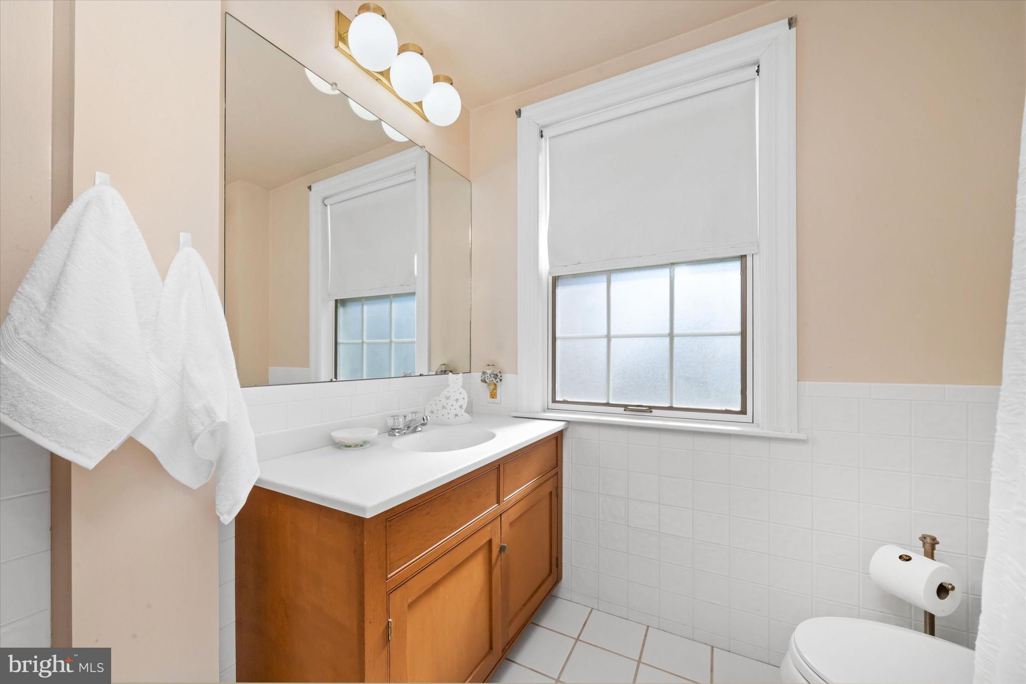 1509 Turkey Run Road Wilmington, DE 19803 - Photo 19 of 31 a bathroom with a sink and a mirror
