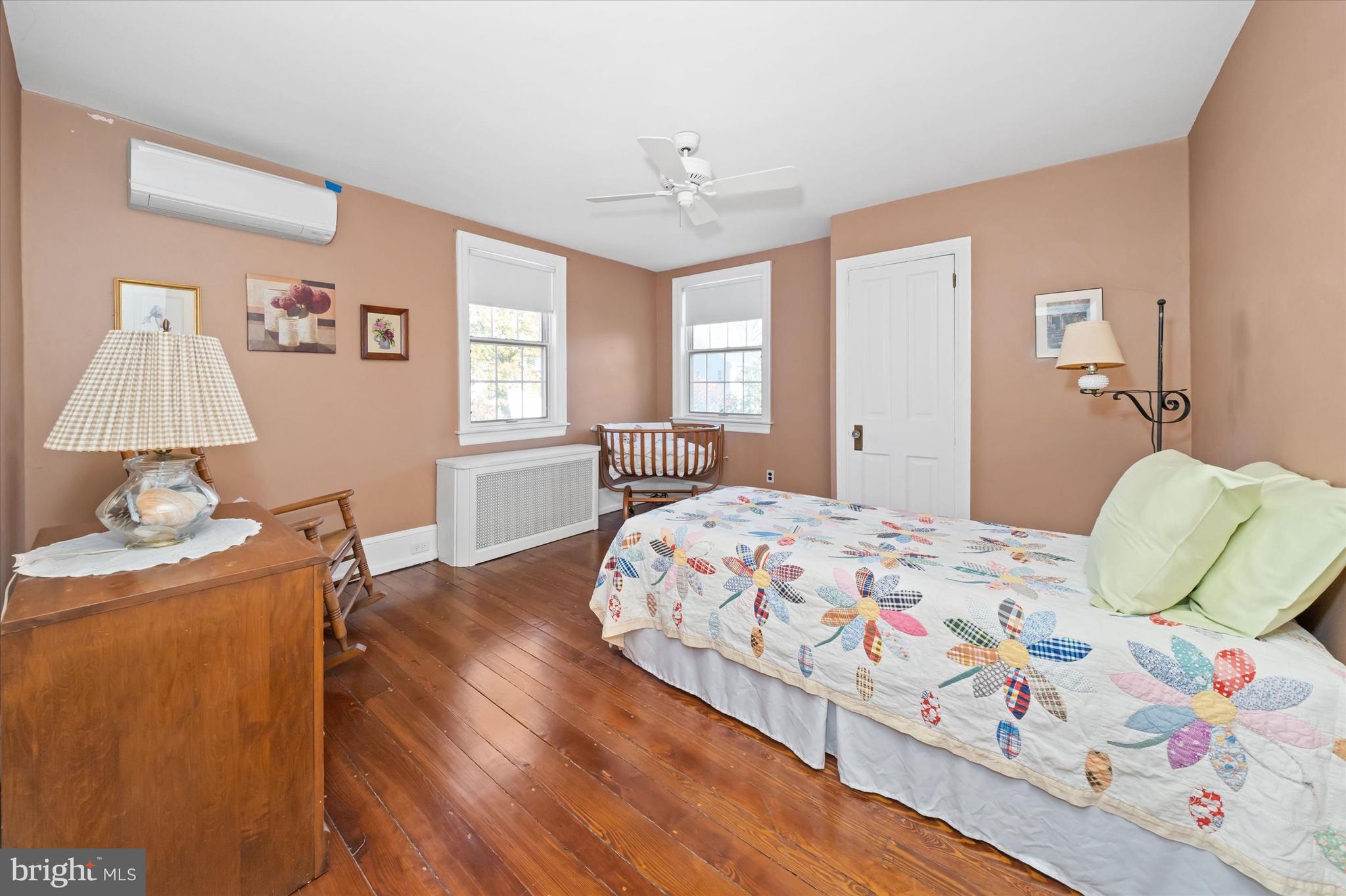 1509 Turkey Run Road Wilmington, DE 19803 - Photo 20 of 31 a bedroom with a bed and wooden floor