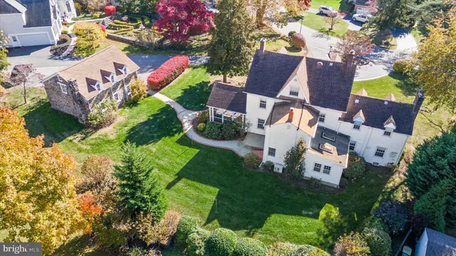 an aerial view of residential house with outdoor space and street view