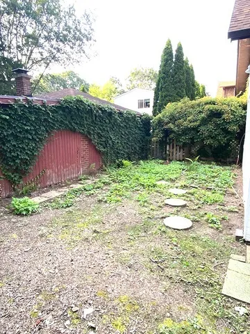 a view of a backyard of the house
