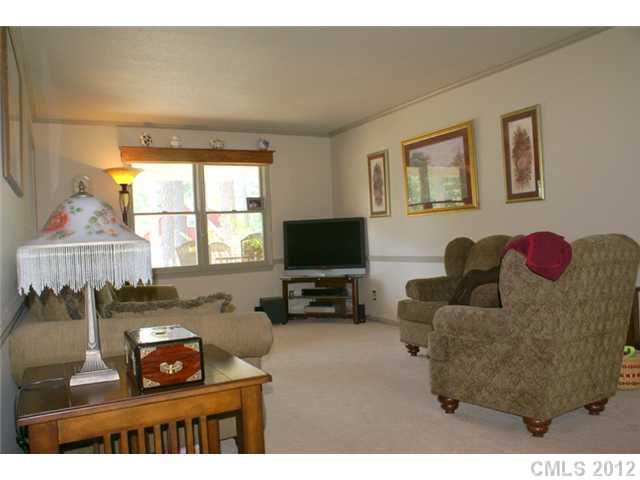 12 Friendfield Court Fort Mill, SC 29715 - Photo 2 of 15 a living room with furniture and a flat screen tv