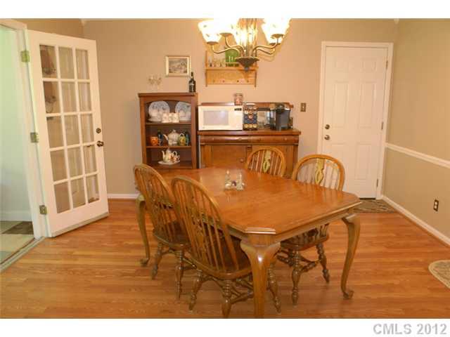 12 Friendfield Court Fort Mill, SC 29715 - Photo 7 of 15 a dining room with furniture and wooden floor