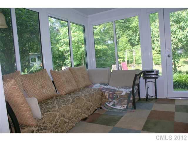 12 Friendfield Court Fort Mill, SC 29715 - Photo 8 of 15 a living room with furniture and a large window