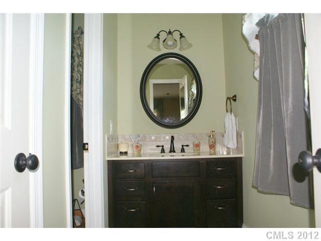 12 Friendfield Court Fort Mill, SC 29715 - Photo 10 of 15 a bathroom with a sink and a mirror