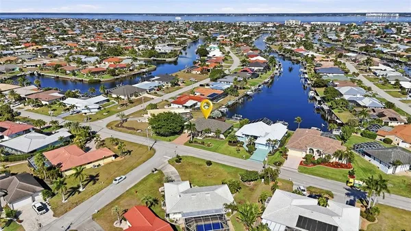 an aerial view of residential houses with outdoor space