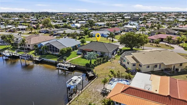 an aerial view of a house with a ocean view