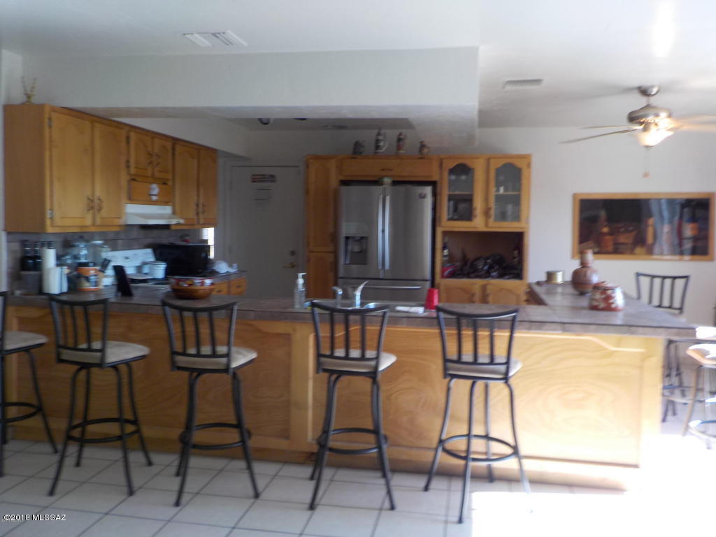 1215 Circulo Aguilar Rio Rico, AZ 85648 - Photo 3 of 12 a view of a dining room with furniture