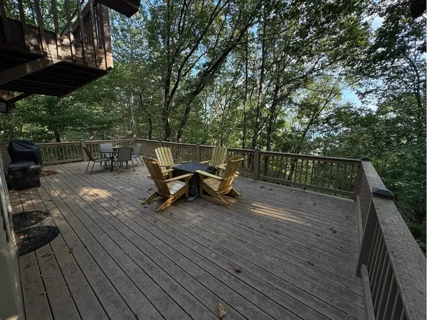 a view of backyard with sitting area