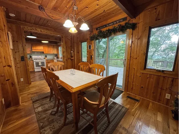 a view of a patio with a table and chairs