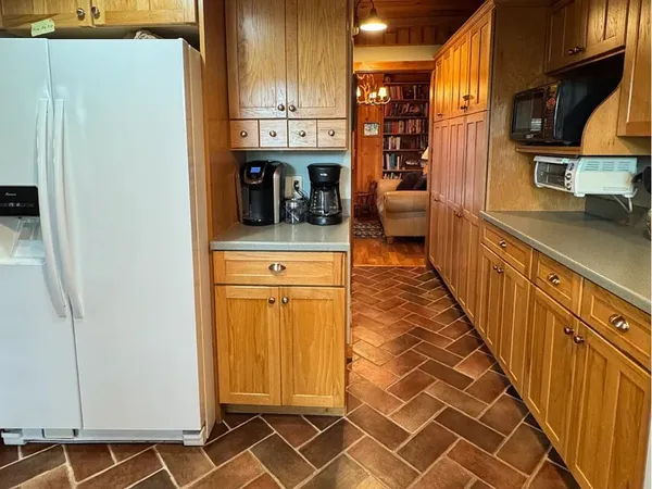 a kitchen with stainless steel appliances a refrigerator and a stove