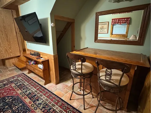 a front view of a house with wooden floor and a hallway