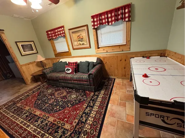 a living room with furniture and a rug