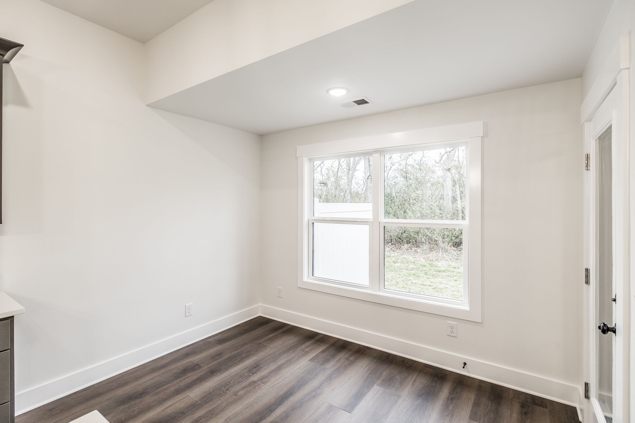 2157 Rylee Way Greenbrier, TN 37073 - Photo 14 of 35 an empty room with wooden floor and windows