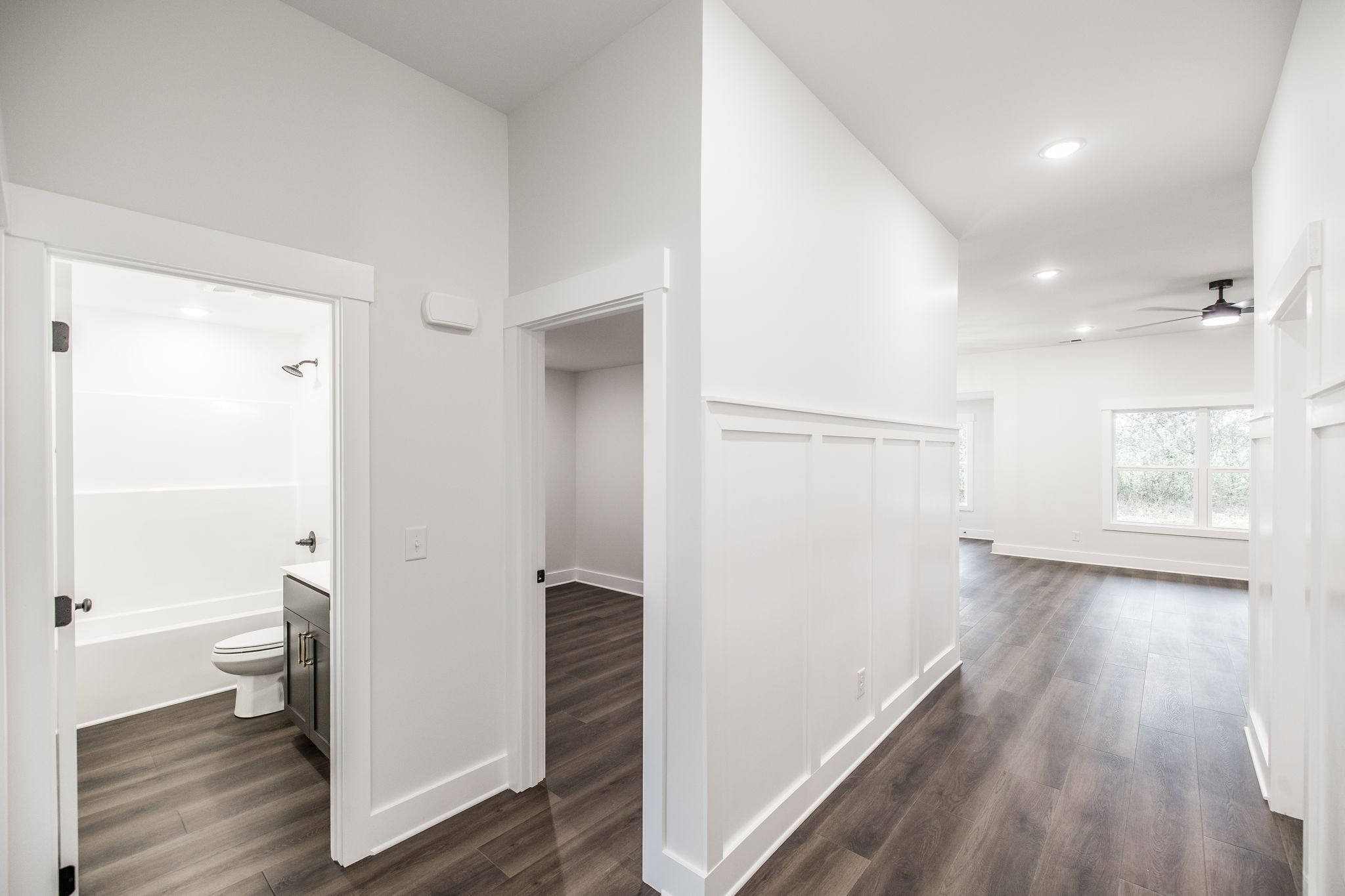 2157 Rylee Way Greenbrier, TN 37073 - Photo 2 of 35 a view of a hallway with wooden floor and a bathroom
