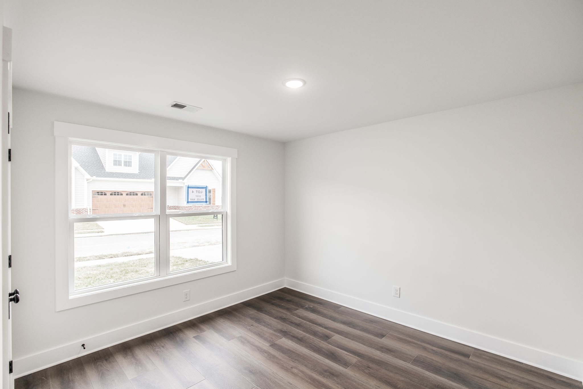 2157 Rylee Way Greenbrier, TN 37073 - Photo 27 of 35 an empty room with wooden floor and windows