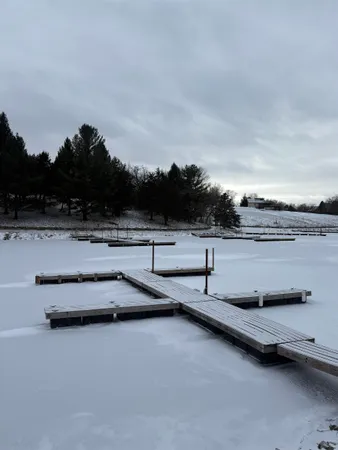a view of swimming pool with furniture