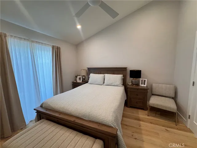 a bedroom with a bed and a couch