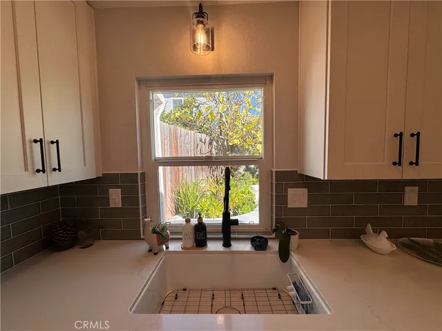 a view of a kitchen with a large window