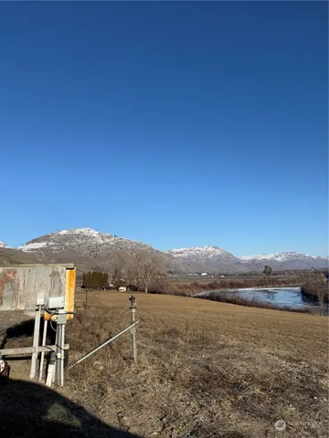 a view of an ocean with mountain