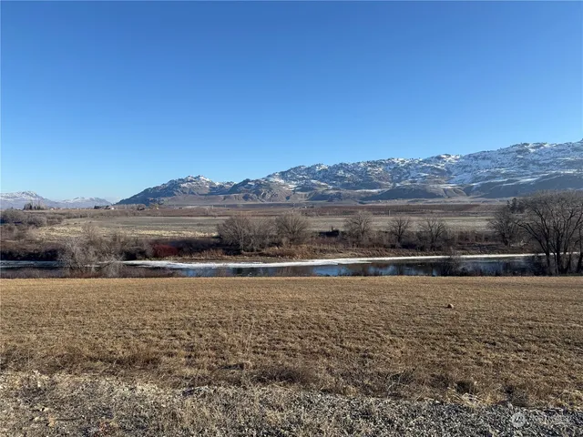 a view of an ocean beach and mountain