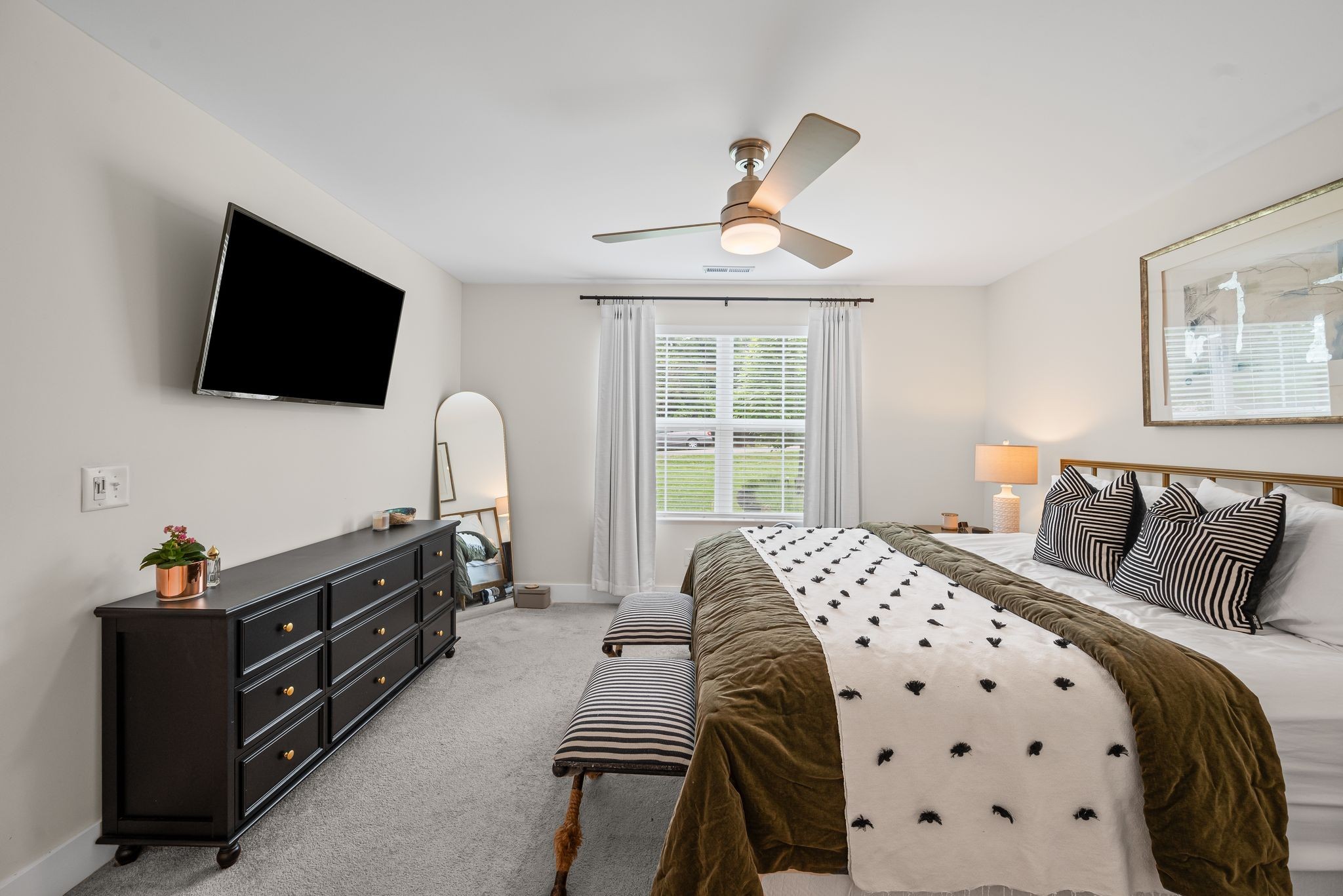 317 Manzano Road Madison, TN 37115 - Photo 27 of 42 a bedroom with a bed and a flat screen tv