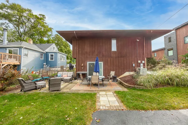 a building outdoor space with patio furniture and potted plants