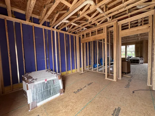 a view of a hallway with wooden walls and windows