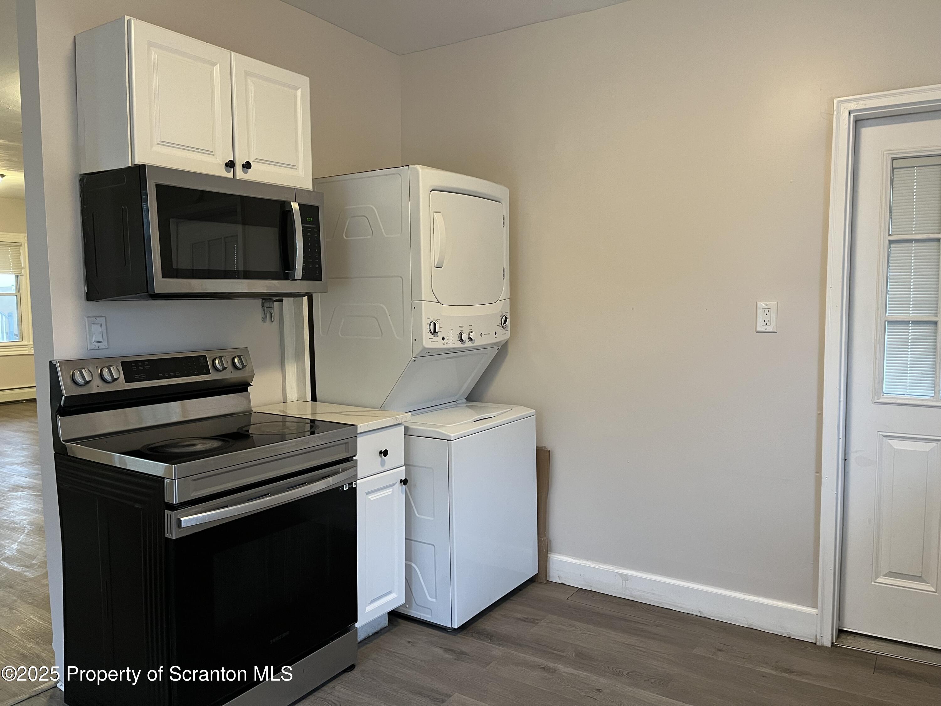 315 Aswell Court Scranton, PA 18504 - Photo 3 of 17 a kitchen with a stove and a microwave