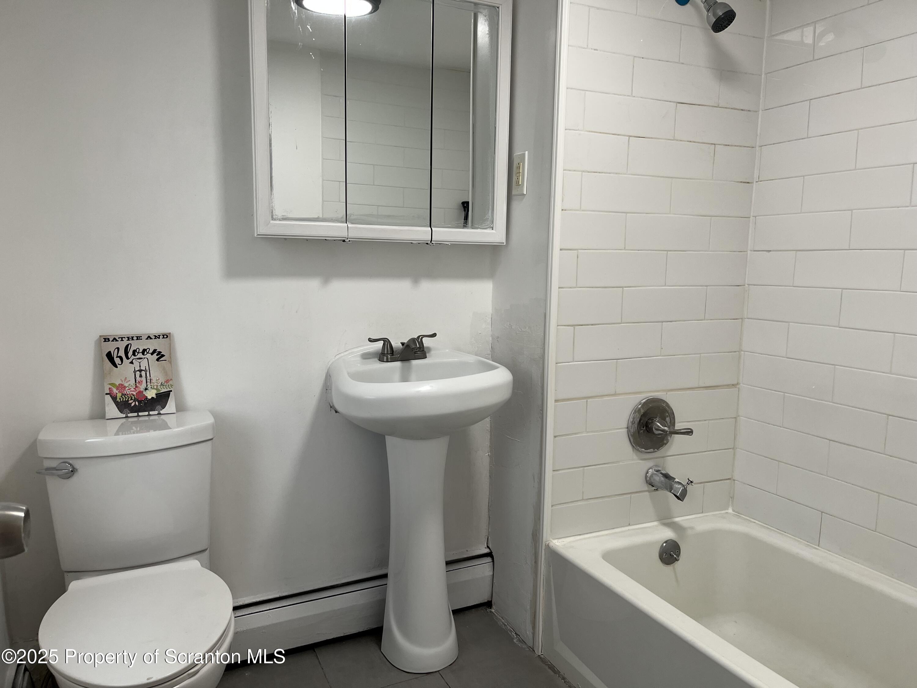 315 Aswell Court Scranton, PA 18504 - Photo 7 of 17 a bathroom with a sink a toilet and shower
