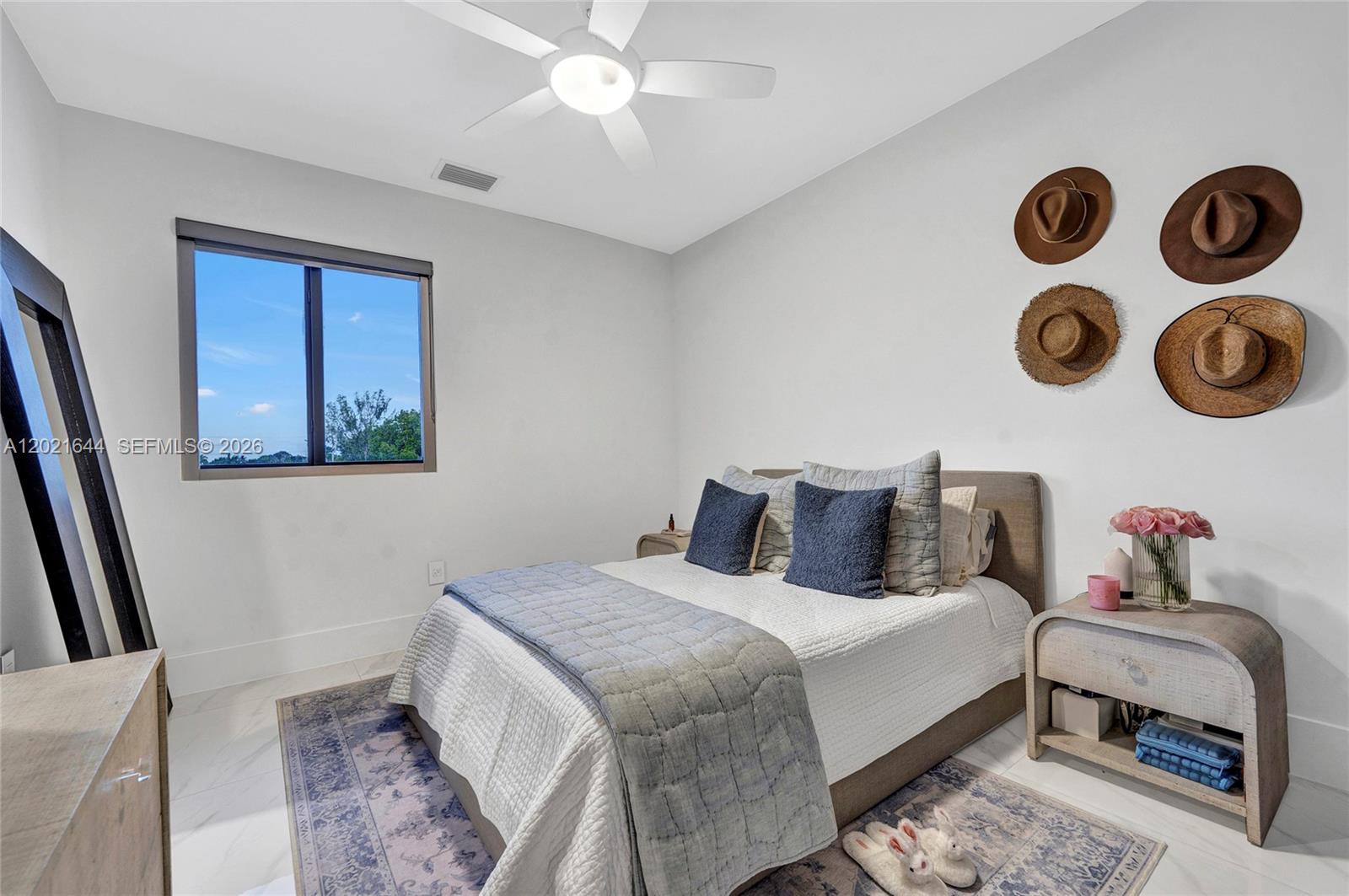 7800 Southwest 9th Terrace Miami, FL 33144 - Photo 57 of 64 a bedroom with a bed and a window