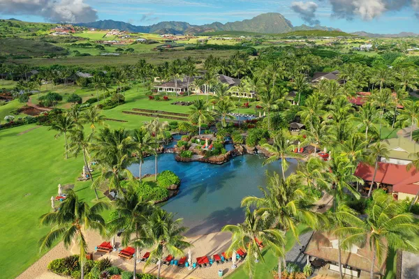 a view of a golf course with an ocean view