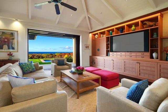 a large kitchen with stainless steel appliances granite countertop a stove a sink dishwasher a dining table and chairs with wooden floor