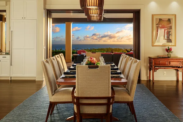 a roof deck with table and chairs