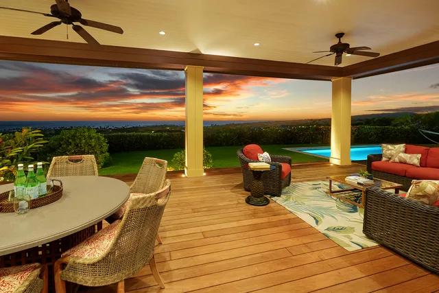 a bedroom with a large bed and a large window