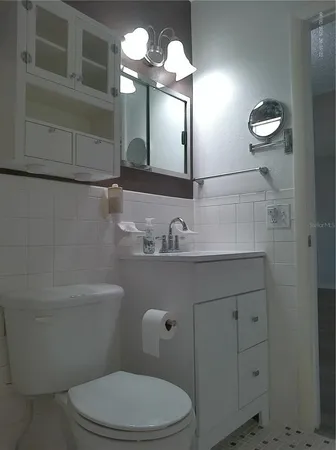 an empty room with wooden floor and closet