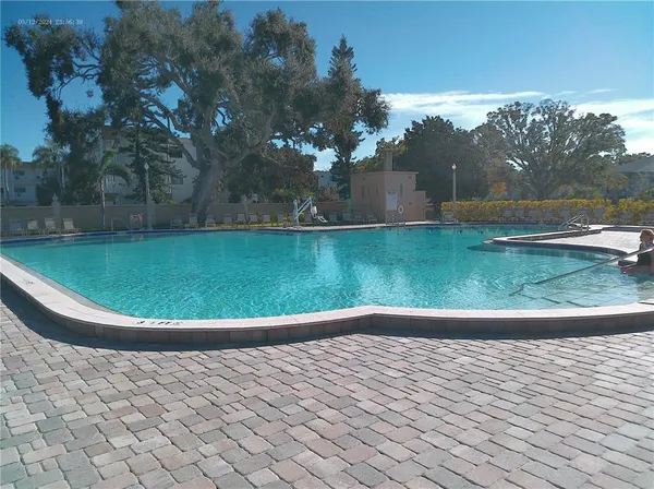 a view of swimming pool from a balcony