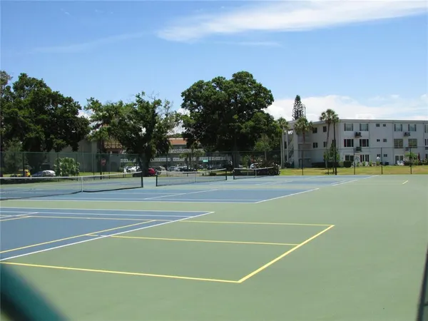 a dining room with furniture and chandelier