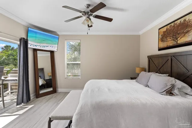 a bedroom with a large bed and a tv