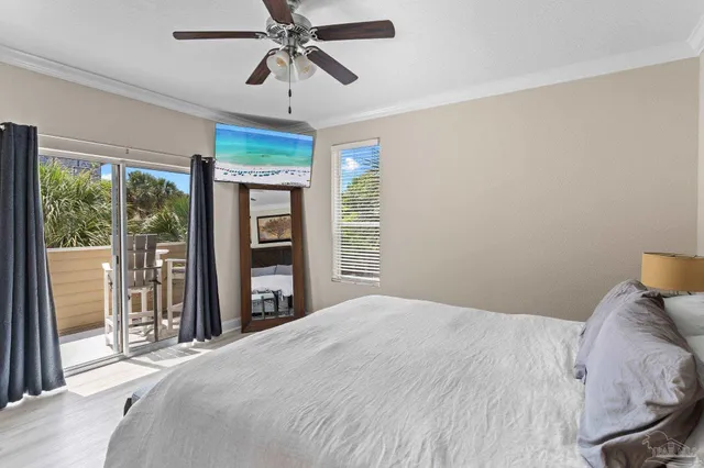 a bedroom with a large bed and a window