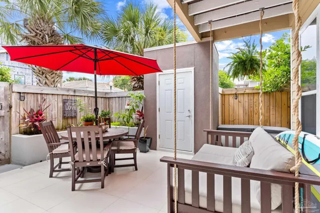 a view of a chair and table in the patio