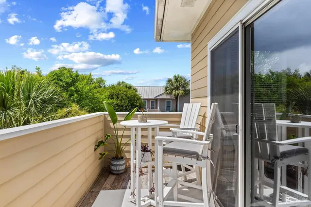 a view of balcony with furniture
