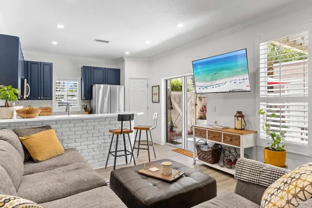 a living room with furniture and a table
